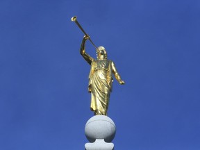 FILE - In this April 6, 2019, file photo, the angel Moroni statue sits atop the Salt Lake City temple, in Salt Lake City. The Church of Jesus Christ of Latter-day Saints came out Monday, May 13, 2019, against a comprehensive nondiscrimination bill that faces long odds in Congress, saying the legislation doesn't "meet the standard of fairness for all" because it would strip key religious freedom protections.