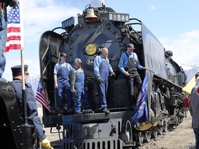 The crew from the Living Legend, No. 844 pose for a photograph during the commemoration of the 150th anniversary of the Transcontinental Railroad completion at Union Station Thursday, May 9, 2019, in Ogden, Utah.