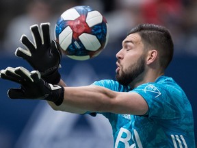 Vancouver Whitecaps goalkeeper Maxime Crepeau reaches for the ball as it goes wide of the goal during the first half of an MLS soccer game against the Philadelphia Union in Vancouver on Saturday, April 27, 2019. The Whitecaps may be facing the bottom league in the Major League Soccer standings this weekend, but they're not taking anything for granted.