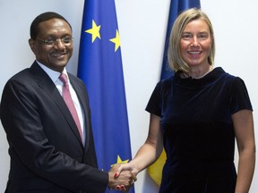 European Union foreign policy chief Federica Mogherini shakes hands with Chad's Foreign Minister Cherif Mahamat Zene prior to a meeting at the Europa building, Monday, May 13, 2019.