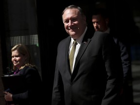 U.S. Secretary of State Mike Pompeo, center, leaves after a meeting at the Europa building in Brussels, Monday, May 13, 2019.