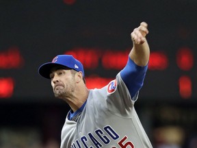 Chicago Cubs starting pitcher Cole Hamels throws to a Seattle Mariners batter during the first inning of a baseball game Tuesday, April 30, 2019, in Seattle.