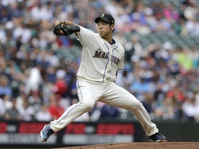 Seattle Mariners starting pitcher Yusei Kikuchi works against the Minnesota Twins during the first inning of a baseball game, Sunday, May 19, 2019, in Seattle.