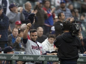 Minnesota Twins' Nelson Cruz tips his cap to fans at the end of the first inning of the team's baseball game against the Seattle Mariners, Thursday, May 16, 2019, in Seattle. Cruz played several seasons in Seattle. The Twins won 11-6.