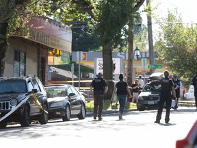 Seattle police investigate a shooting with multiple victims Friday May 10, 2019, in Seattle. The suspects reportedly fled the scene.