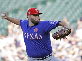 Texas Rangers starting pitcher Lance Lynn throws against the Seattle Mariners during the first inning of a baseball game, Monday, May 27, 2019, in Seattle.