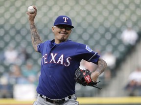 Texas Rangers pitcher Jesse Chavez throws during the first inning of a baseball game against the Seattle Mariners, Tuesday, May 28, 2019, in Seattle.