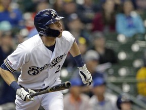 Milwaukee Brewers' Christian Yelich watches the ball after hitting a solo home run during the first inning of a baseball game against the Washington Nationals Wednesday, May 8, 2019, in Milwaukee.