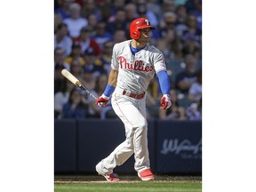 Philadelphia Phillies' Cesar Hernandez watches his run-scoring single against the Milwaukee Brewers during the fourth inning of a baseball game Saturday, May 25, 2019, in Milwaukee.