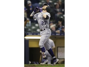 Colorado Rockies' Trevor Story looks up after his three-run home run against the Milwaukee Brewers during the eighth inning of a baseball game Wednesday, May 1, 2019, in Milwaukee.