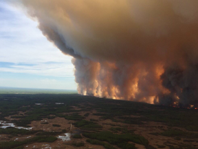 The Chuckegg Creek wildfire burns in the High Level Forest Area, to the southwest and west of the town of High Level, Alberta.