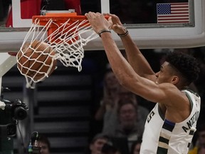 Milwaukee Bucks' Giannis Antetokounmpo dunks during the second half of Game 2 of the NBA Eastern Conference basketball playoff finals against the Toronto Raptors Friday, May 17, 2019, in Milwaukee. The Bucks won 125-103 to take a 2-0 lead in the series.