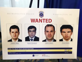 FILE - In this June 15, 2017, file photo, pictures of people facing criminal charges are seen after a news conference in Washington, about an May 16, 2017, altercation outside the Turkish Embassy in Washington during the visit of the Turkish president. Lawsuits arising from a brawl outside the Turkish ambassador's residence in Washington are raising tough questions of law and diplomacy, including about how much legal protection should be extended to the people who protect international leaders from raucous demonstrations when they travel abroad.