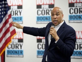 FILE - In this April 15, 2019 file photo, Democratic presidential candidate Sen. Cory Booker, D-N.J., speaks during an election stop at the Sioux City Public Museum in Sioux City, Iowa.  The campaign of presidential candidate Cory Booker is defending his decision to start a tech company while he was serving as mayor of New Jersey's largest city. A spokeswoman says that Booker "jumped at the chance" to start Waywire in 2012 because he saw it as a socially-conscious video network that could bring people together. But his one-time aspiration to be a tech mogul, and his long ties to the industry, could become a liability for his campaign.