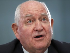 FILE - In this Feb. 27, 2019, file photo, Agriculture Secretary Sonny Perdue testifies during a House Agriculture Committee hearing on Capitol Hill in Washington. Perdue says his agency is "in the throes of constructing" an aid package for farmers hurt by retaliatory tariffs, but he could not say when it would be ready. Perdue says his agency is seeking feedback from producers about the strengths and weaknesses of last year's relief package, valued at nearly $12 billion.