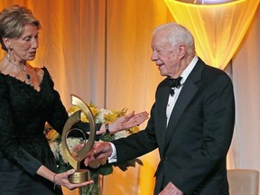 FILE - In this Jan. 27, 2017, file photo, former President Jimmy Carter, right, accepts the O'Connor Justice Prize from former U.S. Ambassador to Finland Barbara Barrett, left, at The Sandra Day O'Connor College of Law at Arizona State University Justice Prize Dinner in Phoenix. President Donald Trump has nominated Barrett to be the next secretary of the Air Force.