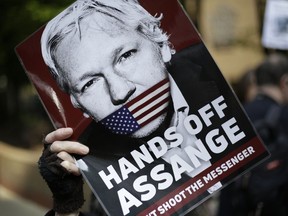 Protesters demonstrate on May 1, 2019 outside court where Julian Assange will appear in London. The Justice Department has charged Assange with receiving and publishing classified information.