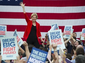 In this May 16, 2019, photo, Democratic presidential candidate Sen. Elizabeth Warren, D-Mass., addresses a campaign rally at George Mason University in Fairfax, Va. Warren is gaining traction with black women debating which Democratic presidential candidate to back in a historically diverse primary.