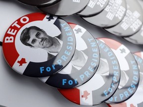 FILE - In this March 15, 2019, file photo, buttons for Democratic presidential candidate former Texas congressman Beto O'Rourke sit on display during a stop at the Central Park Coffee Company in Mount Pleasant, Iowa. O'Rourke entered the 2020 presidential race in mid-March as a political phenomenon, addressing overflow crowds around the country in off-the-cuff ways. Now, with that buzz cooling, O'Rourke is preparing a planned "re-introduction" that will see him do more national television appearances and concentrate on producing a series of detailed policy proposals.