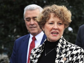 FILE - In this Jan. 15, 2019, file photo, Rep. Susan Brooks, R-Ind., joined by, from back left, Rep. Brad Wenstrup, R-Ohio, speaks to reporters outside the West Wing following a meeting with President Donald Trump about border security at the White House in Washington.