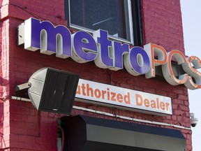 A speaker is on the wall outside the Metro PCS store, Saturday, May 25, 2019 in the Shaw neighborhood of Washington. The owner of the store was told to turn down the Go Go music that he had been playing through sidewalk speakers for more than 20 years. He claims the complaint came from a resident of the gleaming new mixed-used apartment building erected on the next block.  Go-go music, a distinctive Washington DC-specific offshoot of funk, has endured for decades through cultural shifts, fluctuations in popularity and law enforcement purges. Now go-go has taken on a new mantle: battle hymn for the fight against a gentrification wave that's reshaping the city.