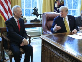 FILE - In this April 4, 2019, file photo, President Donald Trump meets China's Vice Premier Liu He in the Oval Office of the White House in Washington.