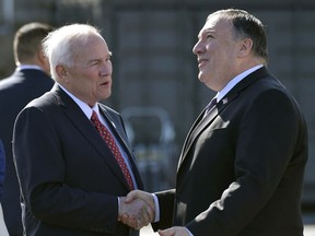 Secretary of State Mike Pompeo, right, shakes hands with the U.S. ambassador to Finland, Robert Frank Pence, after arriving in Rovaniemi, Finland, Monday, May 6, 2019.