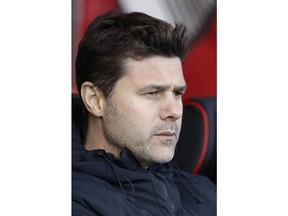 Tottenham manager Mauricio Pochettino sits on the bench at the start of the English Premier League soccer match between AFC Bournemouth and Tottenham Hotspur at the Vitality Stadium in Bournemouth, England, Saturday May 4, 2019.