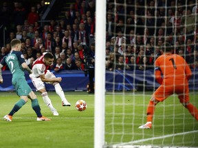 Ajax's Dusan Tadic, 2nd left, attempts a shot at goal during the Champions League semifinal second leg soccer match between Ajax and Tottenham Hotspur at the Johan Cruyff ArenA in Amsterdam, Netherlands, Wednesday, May 8, 2019.