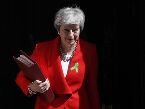 Britain's Prime Minister Theresa May leaves 10 Downing Street for her weekly Prime Minister's Questions in the House of Commons in London, Wednesday, May 15, 2019.