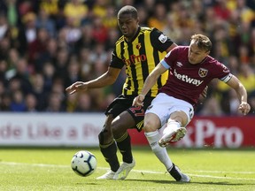 West Ham United's Mark Noble scores his side's first goal of the game during the English Premier League soccer match between Watford and West Ham United, at Vicarage Road, in Watford, England, Sunday, May 12, 2019.