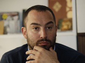 Francesco Polacchi, regional coordinator of Casapound extreme right political party, and founder of Altaforte publishing company, answers to reporters during a news conference, in Milan, Italy, Wednesday, May 8, 2019. Holocaust survivor, poet Halina Birenbaum, is set to open a book fair in Turin after the organizers agreed to demands that she and the Auschwitz-Birkenau state museum made to remove the stand of Altaforte publishing company.