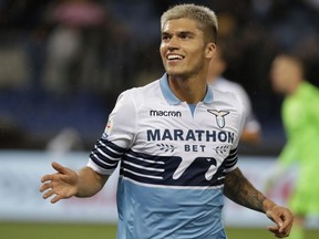 Lazio's Joaquin Correa celebrates after scoring his team's first goal during an Italian Serie A soccer match between Lazio and Bologna, at the Olympic stadium in Rome, Monday, May 20, 2019.