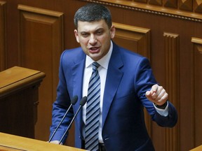 Ukrainian Prime Minister Volodymyr Groysman gestures as he addresses the Ukrainian parliament in Kiev, Ukraine, Thursday, May 30, 2019. Ukrainian lawmakers refused to accept the Cabinet's resignation in a snub to the nation's newly-sworn president, Volodymyr Zelenskiy, who wants to form his own team but faces parliament dominated by supporters of his election rival.