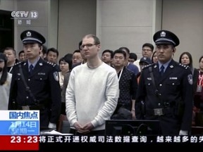 FILE - In this file image taken from Jan. 14, 2019, video footage run by China's CCTV, Canadian Robert Lloyd Schellenberg attends his retrial at the Dalian Intermediate People's Court in Dalian, northeastern China's Liaoning province. A Chinese court has held an appeal hearing Thursday, May 9, 2019, for the Canadian who was sentenced to death for drug smuggling. No decision was immediately announced after the hearing. (CCTV via AP, File)