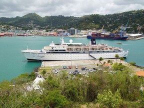The Freewinds cruise ship is docked in the port of Castries, the capital of St. Lucia, Thursday, May 2, 2019. Authorities in the eastern Caribbean island have quarantined the ship after discovering a confirmed case of measles aboard.