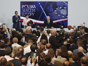 Jaroslaw Kaczynski, leader of PiS party ,Law and Justice, gives a speech after announcing the first results of the European parliament election in Warsaw, Poland, Sunday, May 26, 2019.The poster on the wall reads "Poland heart of Europe".