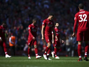 Liverpool players come out for the second half during the English Premier League soccer match between Liverpool and Wolverhampton Wanderers at the Anfield stadium in Liverpool, England, Sunday, May 12, 2019. Despite a 2-0 win over Wolverhampton Wanderers, Liverpool missed out on becoming English champion for the first time since 1990 because title rival Manchester City beat Brighton 4-1.