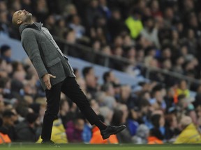 Manchester City manager Pep Guardiola reacts during the English Premier League soccer match between Manchester City and Leicester City at the Etihad stadium in Manchester, England, Monday, May 6, 2019.