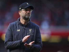 Liverpool manager Juergen Klopp greets supporters at the end of the English Premier League soccer match between Liverpool and Wolverhampton Wanderers at the Anfield stadium in Liverpool, England, Sunday, May 12, 2019. Despite a 2-0 win over Wolverhampton Wanderers, Liverpool missed out on becoming English champion for the first time since 1990 because title rival Manchester City beat Brighton 4-1.