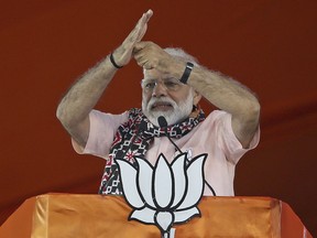FILE - In this April 1, 2019, file photo, Indian Prime Minister Narendra Modi gestures as he speaks during an election campaign rally of his Bharatiya Janata Party (BJP) in Hyderabad, India. In the world's largest democracy, few issues reach as broad a consensus as Kashmir, that the Muslim-majority region must remain part of Hindu-majority India. Modi is using this, and a February attack on Indian paramilitary forces in Kashmir, to consolidate the Hindu vote in India's five-week elections that conclude May 21 to bolster his campaign-slogan claim to be India's chowkidar, or watchman.
