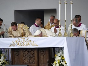 Pope Francis kisses the altar as he celebrates Mass in Knyaz Alexandar Square in Sofia, Bulgaria, Sunday, May 5, 2019. Pope Francis is visiting Bulgaria, the European Union's poorest country and one that taken a hard line against migrants, a stance that conflicts with the pontiff's view that reaching out to vulnerable people is a moral imperative.