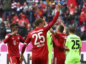 Bayern's Franck Ribery, second right, celebrates with his teammates after scoring his side's third goal during the German Bundesliga soccer match between FC Bayern Munich and Hannover 96 in Munich, Germany, Saturday, May 4, 2019.