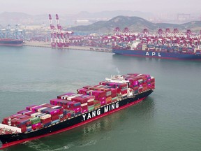 A container ship sails off the dockyard in Qingdao in eastern China's Shandong province Wednesday, May 8, 2019. China's exports fell unexpectedly in April, adding to pressure on Beijing ahead of negotiations on ending a tariff war with Washington over Chinese technology ambitions. (Chinatopix Via AP)