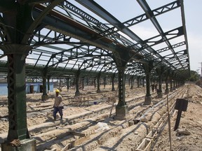 Workers rebuild and refurbish the central station in Havana, Cuba, Wednesday, May 22, 2019. Cuba's railway system is undergoing a major overhaul, with the government pushing a program to revamp the decrepit and aging network with new cars and locomotives in the hope of restoring a rail service that was once the envy of Latin America.