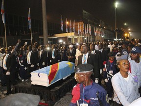 The coffin carrying the remains of longtime Congolese opposition leader Etienne Tshisekedi arrives at Kinshasa airport Thursday, May 30, 2019. The body of Tshisekedi, father of the current Congolese President Felix Tshisekedi, died in Brussels in February 2017, was returned to home soil Thursday night for burial more than two years after his death, after a political standoff ended.