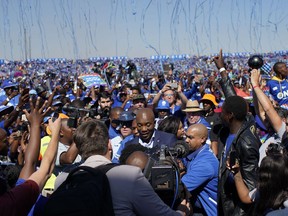 Democratic Alliance leader Mmusi Maimane greets supporters as he arrives at the Dobsonville Stadium in Johannesburg, South Africa, Saturday May 4, 2019, ahead of South Africa's election on May 8.