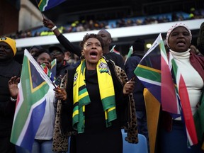 African National Congress party (ANC) supporters gather for the swearing-in ceremony for South African President Cyril Ramaphosa at Loftus Versfeld stadium in Pretoria, South Africa, Saturday May 25, 2019. Ramaphosa has vowed to crack down on the corruption that contributed to the ruling ANC' s weakest election showing in a quarter-century.