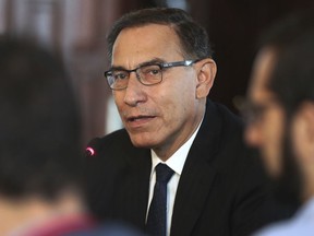 FILE - In this Oct. 29, 2018 file photo, Peru's President Martin Vizcarra speaks during a press conference with foreign press at the government palace in Lima, Peru. In another move of political maneuvering, Vizcarra has placed congress, which is controlled by the opposition, on the verge of being dissolved in 2019.