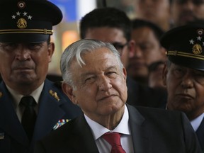 FILE - In this April 29, 2019 file photo, Mexican President Andrés Manuel López Obrador attends a ceremony at the Military Airbase Number 1 in Santa Lucia, on the outskirts of Mexico City. Mexico's Congress approved a series of safeguards Thursday, May 23, intended to prevent abuses under the country's new militarized police force known as the National Guard.